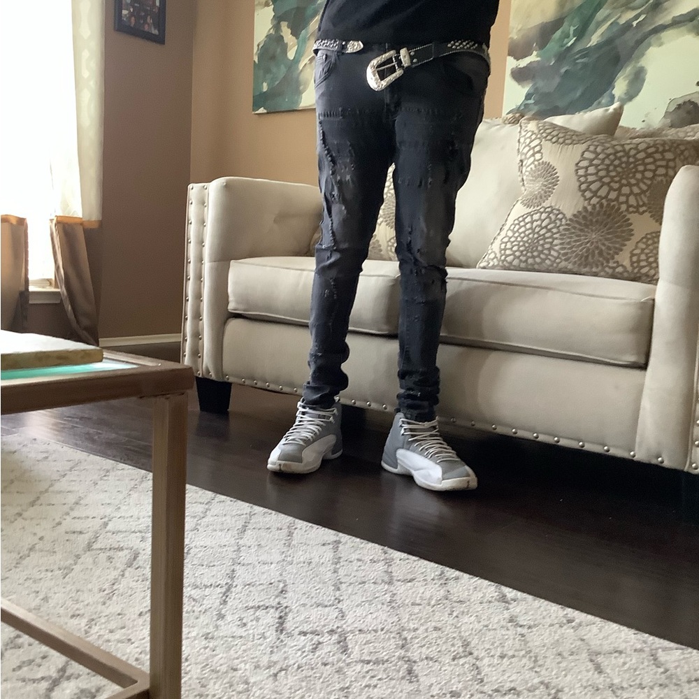 Distressed black denim mens jeans.